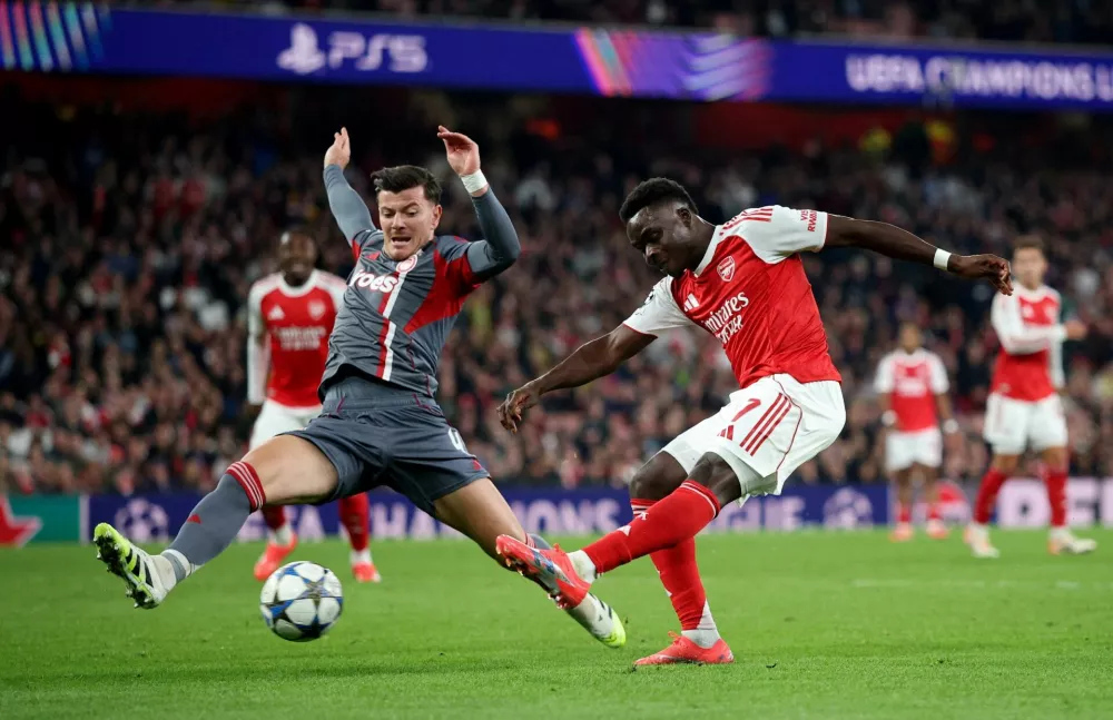 Soccer Football - UEFA Champions League - Arsenal v Olympiacos - Emirates Stadium, London, Britain - October 1, 2025 Arsenal's Bukayo Saka scores their second goal Action Images via Reuters/Andrew Boyers   TPX IMAGES OF THE DAY