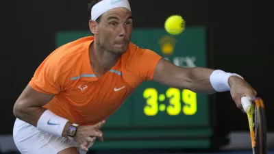 Rafael Nadal of Spain plays a forehand return to Jack Draper of Britain during their first round match at the Australian Open tennis championship in Melbourne, Australia, Monday, Jan. 16, 2023. (AP Photo/Aaron Favila)