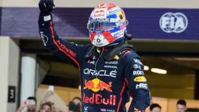Red Bull driver Max Verstappen of the Netherlands celebrates the pole position after the qualifying for the he Abu Dhabi Formula One Grand Prix in Abu Dhabi, United Arab Emirates, Saturday, Dec. 6, 2025. (AP Photo/Darko Bandic)