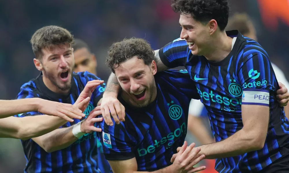 06 December 2025, Italy, Milan: Inter Milan's Carlos Augusto celebrates scoring his side's fourth goal during the Italian Serie A soccer match between Inter Milan and Como 1907 at San Siro Stadium. Photo: Spada/LaPresse via ZUMA Press/dpa