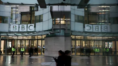 FILE PHOTO: People stand outside BBC Broadcasting House, after Director General Tim Davie and CEO of BBC News Deborah Turness resigned on Sunday, November 9, following accusations of bias at the British broadcaster, including in the way it edited a speech by U.S. President Donald Trump, in London, Britain, November 14, 2025. REUTERS/Isabel Infantes/File Photo