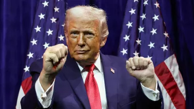 FILE PHOTO: U.S. President Donald Trump gestures as he addresses House Republicans at their annual issues conference retreat, at the Kennedy Center, renamed the Trump-Kennedy Center by the Trump-appointed board of directors, in Washington, D.C., U.S., January 6, 2026. REUTERS/Kevin Lamarque/File Photo