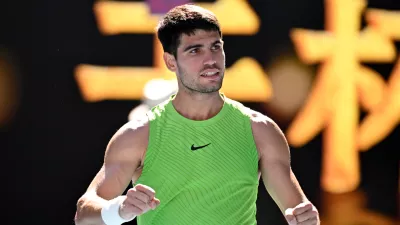 21 January 2026, Australia, Melbourne: Carlos Alcaraz of Spain celebrates match point during the Mens 2nd round match against Yannick Hanfmann of Germany on day 4 of the 2026 Australian Open tennis tournament at Melbourne Park in Melbourne. Photo: James Ross/AAP/dpa