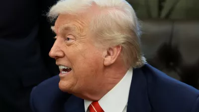 U.S. President Donald Trump reacts during the signing of a bill to end the partial government shutdown, at the White House in Washington, D.C., U.S., February 3, 2026. REUTERS/Evelyn Hockstein