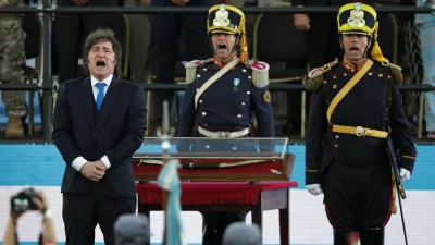 Argentina's President Javier Milei stands in front of the curved sabre that belonged to Argentina's independence leader General Jose de San Martin, during a ceremony to present it to the San Lorenzo regiment, in San Lorenzo, Santa Fe, Argentina, February 7, 2026. REUTERS/Francisco Loureiro   TPX IMAGES OF THE DAY