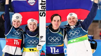10 February 2026, Italy, Predazzo: (L-R) Slovenia's Nika Vodan, Nika Prevc, Domen Prevc and Anze Lanisek celebrate after the Ski Jumping Mixed team competition of the 2026 Winter Olympic Games at Milan-Cortina. Photo: Daniel Karmann/dpa