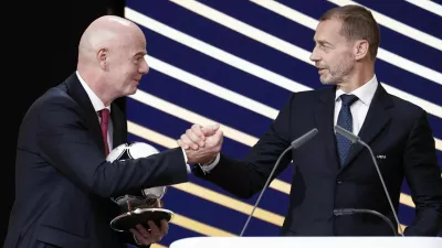 Soccer Football - 50th Ordinary UEFA Congress - Brussels Expo, Brussels, Belgium - February 12, 2026 UEFA president Aleksander Ceferin and FIFA president Gianni Infantino shake hands during the event REUTERS/Benoit Tessier