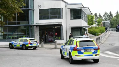 Police vehicles are parked in front of a school following a shooting incident in Trangsund, Huddinge, Sweden September 4, 2024. TT News Agency/Jonas Ekstromer/via REUTERS   ATTENTION EDITORS - THIS IMAGE WAS PROVIDED BY A THIRD PARTY. SWEDEN OUT. NO COMMERCIAL OR EDITORIAL SALES IN SWEDEN.