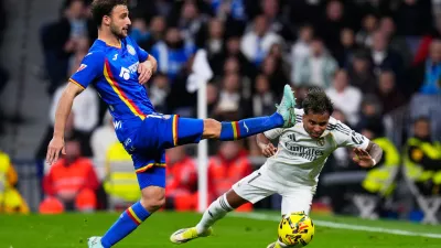 Getafe's Boselli fights for the ball against Real Madrid's Rodrygo during a Spanish La Liga soccer match between Real Madrid and Getafe in Madrid, Spain, Monday, March 2, 2026. (AP Photo/Manu Fernandez)