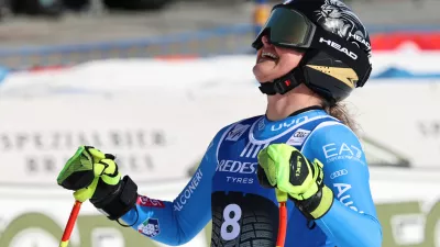 Italy's Laura Pirovano celebrates at the finish area of an alpine ski, women's World Cup downhill, in Val di Fassa, Italy, Friday, February. 27, 2026. (AP Photo/Marco Trovati)