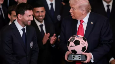 U.S. President Donald Trump is gifted a jewelled soccer ball with his signature on it from Inter Miami CF captain Lionel Messi, on the day he honors reigning Major League Soccer (MLS) champion Inter Miami CF players and team officials with an event in the East Room of the White House in Washington, D.C., U.S., March 5, 2026. REUTERS/Jonathan Ernst