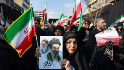 A woman holds a placard with an image of Iran's new supreme leader Mojtaba Khamenei alongside late Iranian Supreme Leader Ayatollah Ali Khamenei, on the day of a gathering to support Mojtaba Khamenei, amid the U.S.-Israeli conflict with Iran, in Tehran, Iran, March 9, 2026. Majid Asgaripour/WANA (West Asia News Agency) via REUTERS ATTENTION EDITORS - THIS PICTURE WAS PROVIDED BY A THIRD PARTY