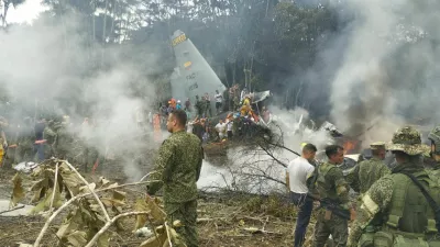 Members of the military gather at the site of a Colombian military plane crash in Puerto Leguizamo, Putumayo, Colombia March 23, 2026. La Voz de Amazonia/Mare Rafue/Handout via REUTERS  THIS IMAGE HAS BEEN SUPPLIED BY A THIRD PARTY. MANDATORY CREDIT  VERIFICATION: Topography mapping and nearby buildings matched satellite imagery Date verified by original file metadata Defense Minister Pedro Sanchez said the accident happened as the Lockheed Martin-built LMT.N Hercules C-130 was taking off from Puerto Leguizamo on the border with Peru