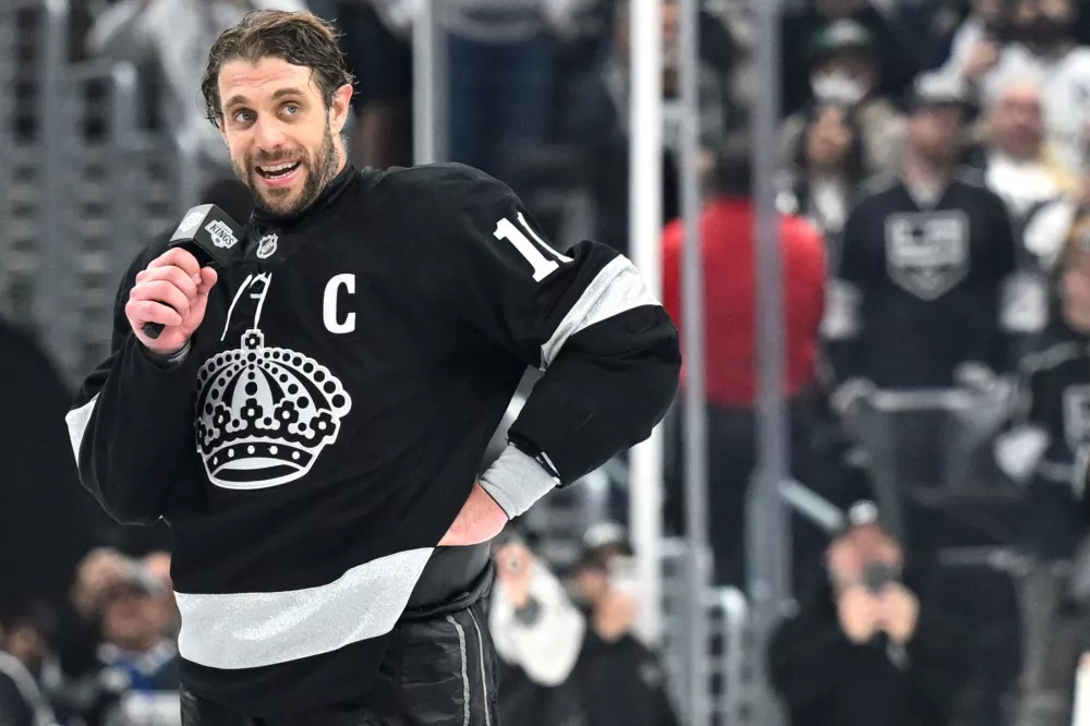Apr 11, 2026; Los Angeles, California, USA; Los Angeles Kings center Anze Kopitar (11) speaks to the fans after the win against the Edmonton Oilers at Crypto.com Arena. Mandatory Credit: Griffin Hooper-Imagn Images