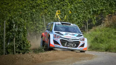 Belgium's Thierry Neuville and his co-driver Nicolas Gilsoul steer the Hyundai through the vineyards during a special stage of the Deutschland Rallye, the German WRC stage, in Neumagen,, Germany, Sunday Aug. 24, 2014. Thierry Neuville held his nerve to win the Rally of Germany after Finland's Jari-Matti Latvala and then Britain's Kris Meeke crashed out of the lead on Sunday. (AP Photo/dpa,Thomas Frey)