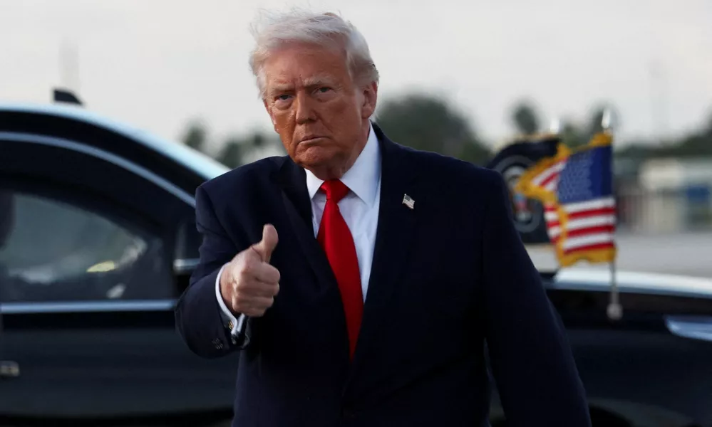 U.S. President Donald Trump gives a thumbs up as he arrives at Miami International Airport in Florida, U.S., April 11, 2026. REUTERS/Kevin Lamarque