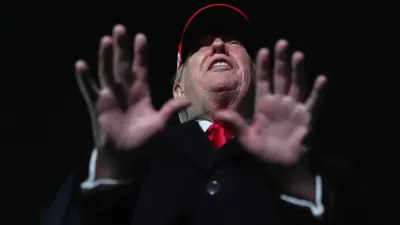 President Donald Trump speaks with reporters at Joint Base Andrews, Md., Sunday, April 12, 2026, after he returned from Miami. (AP Photo/Julia Demaree Nikhinson)