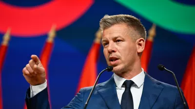 Peter Magyar gestures as he speaks to the media in Budapest, Hungary, Monday, April 13, 2026, after defeating Prime Minister Viktor Orban's party in the country's parliamentary elections. (AP Photo/Denes Erdos)