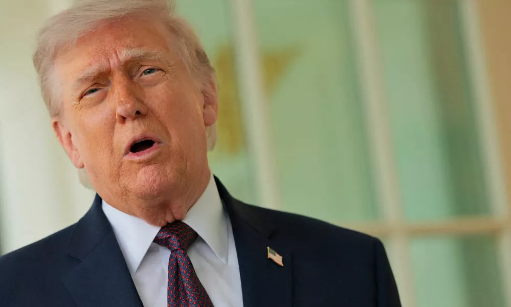 U.S. President Donald Trump speaks with the media after receiving a McDonald's order via DoorDash, which was delivered to him in front of the Oval Office at the White House in Washington, D.C., U.S., April 13, 2026. REUTERS/Jonathan Ernst