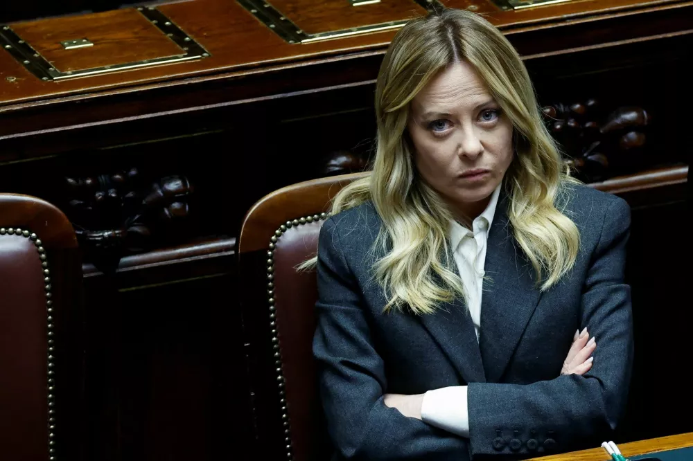 Italy's Prime Minister Giorgia Meloni listens to debate after she reported on her government's actions and was speaking on the latest developments in Iran, at the lower house of Parliament in Rome, Italy, April 9, 2026. REUTERS/Remo Casilli