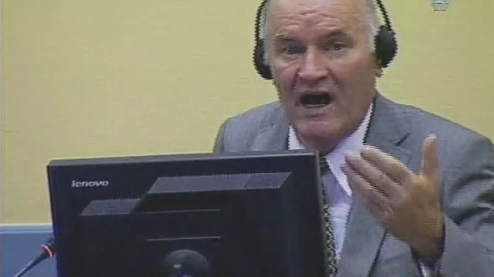 In this image taken from TV former Bosnian Serb military chief Ratko Mladic sits in the court room during his further initial appearance at the U.N.'s Yugoslav war crimes tribunal in The Hague, Netherlands, Monday, July 4, 2011. Mladic has appeared in court at the Yugoslav war crimes tribunal to enter pleas to charges including genocide. The judge refused a request by Ratko Mladic's court-appointed lawyer to postpone initial plea. (AP Photo/ICTY via APTN)