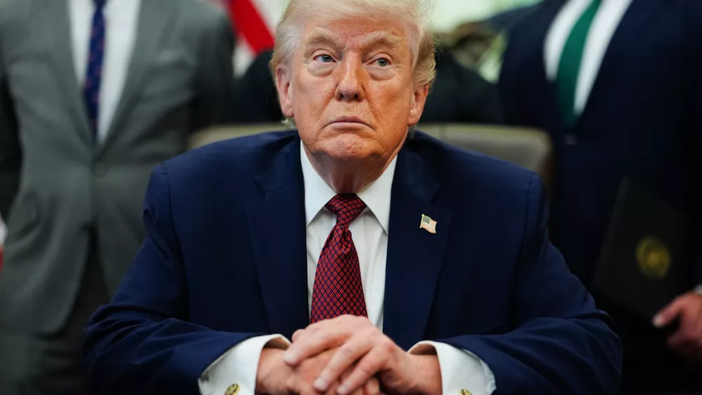 President Donald Trump listens in the Oval Office of the White House, Saturday, April 18, 2026, in Washington. (AP Photo/Julia Demaree Nikhinson)