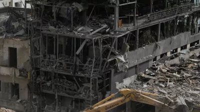 FILE - An excavator removes rubble from destroyed buildings that were hit by Israeli airstrikes on Thursday, as rescuers search for victims in the city of Tyre, southern Lebanon, Saturday, April 18, 2026. (AP Photo/Bilal Hussein, File)