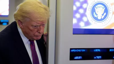 U.S. President Donald Trump listens as he talks to members of the media aboard Air Force One en route to Joint Base Andrews, Maryland, U.S., April 17, 2026. REUTERS/Evan Vucci