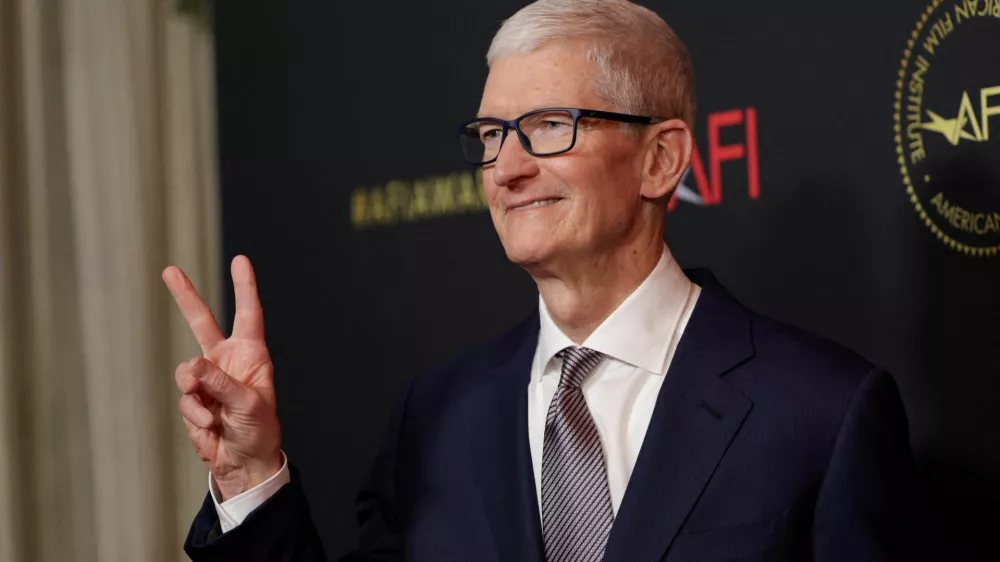 FILE PHOTO: Apple's CEO Tim Cook attends the American Film Institute (AFI) Awards Luncheon in Los Angeles, California, U.S., January 9, 2026. REUTERS/Mario Anzuoni/File Photo
