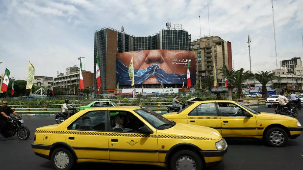 People drive past an anti-U.S. billboard depicting U.S. President Donald Trump and the Strait of Hormuz, in Tehran, Iran, May 2, 2026. Majid Asgaripour/WANA (West Asia News Agency) via REUTERS ATTENTION EDITORS - THIS PICTURE WAS PROVIDED BY A THIRD PARTY