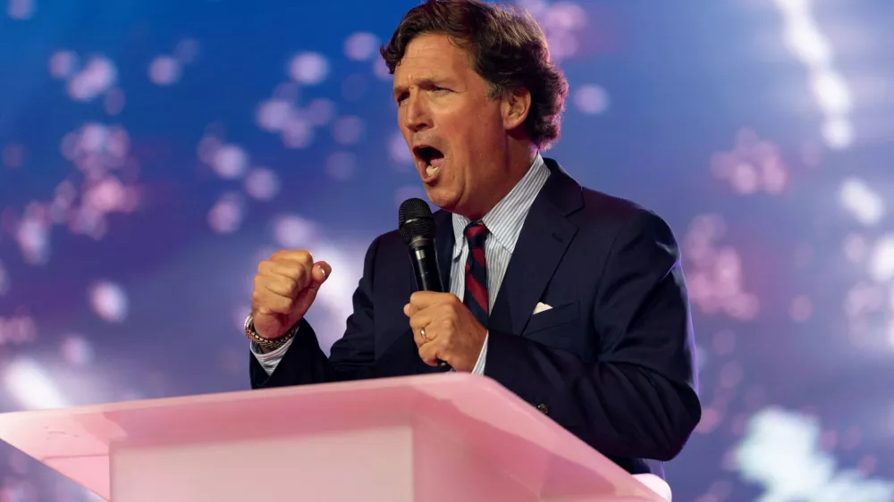 Tucker Carlson speaks during AmericaFest, the first Turning Point USA summit since the death of Charlie Kirk, in Phoenix, Arizona, U.S. December 18, 2025. REUTERS/Cheney Orr