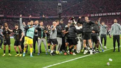 PSG players celebrate after the Champions League semifinal second leg soccer match between Bayern Munich and Paris Saint Germain in Munich, Germany, Wednesday, May 6, 2026. (AP Photo/Martin Meissner)