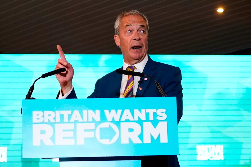 Reform UK leader Nigel Farage speaks to supporters at Chelmsford City Racecourse, Friday May 8, 2026, in Essex, England, following the 2026 local election results. (Jordan Pettitt/PA via AP)