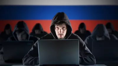 Many russian hackers in troll farm. Cyber crime and security concept. Russia flag in background.