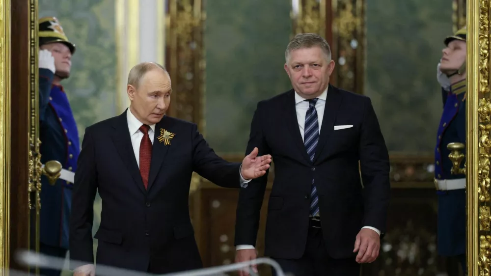 Russian President Vladimir Putin shows the way to Slovak Prime Minister Robert Fico during a meeting in Moscow, Russia May 9, 2026. REUTERS/Ramil Sitdikov/Pool   TPX IMAGES OF THE DAY