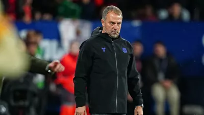 Barcelona's head coach Hansi Flick stands on the touchline during a Spanish La Liga soccer match between Osasuna and Barcelona in Pamplona, Spain, Saturday, May 2, 2026. (AP Photo/Miguel Oses)
