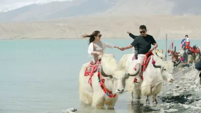 KIZILSU, CHINA - MAY 06: Tourists ride yaks at Baisha Lake scenic area on May 06, 2026 in Kizilsu Kyrgyz Autonomous Prefecture, Xinjiang Uygur Autonomous Region of China. Copyright: xVCGx 111640379766,Image: 1097823982, License: Rights-managed, Restrictions: imago is entitled to issue a simple usage license at the time of provision. Personality and trademark rights as well as copyright laws regarding art-works shown must be observed. Commercial use at your own risk.;PUBLICATIONxNOTxINxCHN, Model Release: no