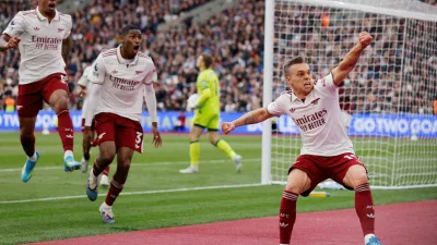 Soccer Football - Premier League - West Ham United v Arsenal - London Stadium, London, Britain - May 10, 2026 Arsenal's Leandro Trossard celebrates scoring their first goal Action Images via Reuters/Andrew Couldridge EDITORIAL USE ONLY. NO USE WITH UNAUTHORIZED AUDIO, VIDEO, DATA, FIXTURE LISTS, CLUB/LEAGUE LOGOS OR 'LIVE' SERVICES. ONLINE IN-MATCH USE LIMITED TO 120 IMAGES, NO VIDEO EMULATION. NO USE IN BETTING, GAMES OR SINGLE CLUB/LEAGUE/PLAYER PUBLICATIONS. PLEASE CONTACT YOUR ACCOUNT REPRESENTATIVE FOR FURTHER DETAILS..   TPX IMAGES OF THE DAY
