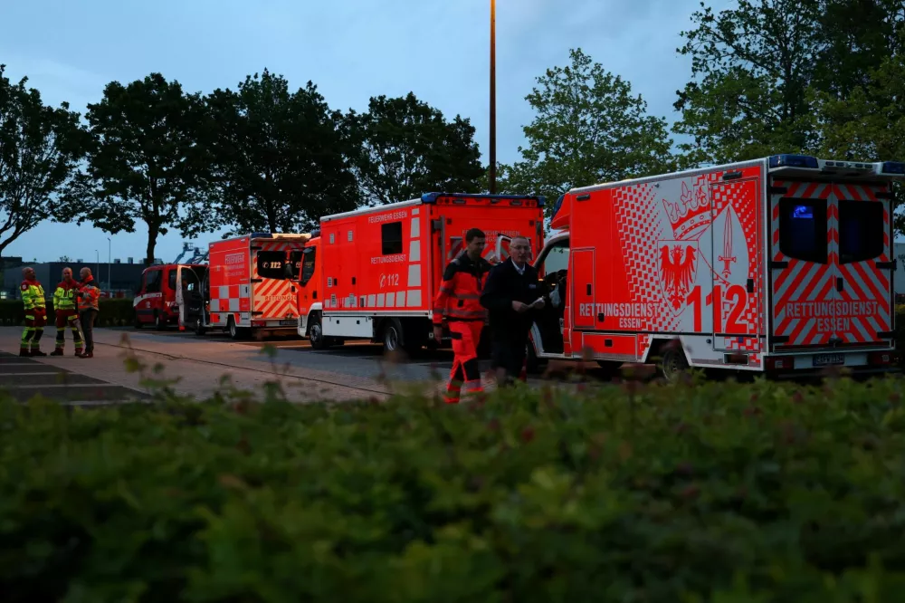 Medical workers and firefighters on the day passengers of the cruise ship MV Hondius, which was affected by a hantavirus outbreak, arrive at the Eindhoven Air Base, Netherlands May 10, 2026. REUTERS/Nicolas Economou