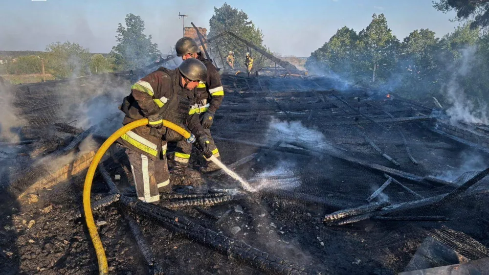 Firefighters work at the site of a kindergarten damaged during a Russian drone strike, amid Russia's attack on Ukraine, in Kyiv region, Ukraine May 12, 2026. Press service of the State Emergency Service of Ukraine in Kyiv region/Handout via REUTERS ATTENTION EDITORS - THIS IMAGE HAS BEEN SUPPLIED BY A THIRD PARTY. WATERMARK FROM SOURCE. MANDATORY CREDIT. BEST QUALITY AVAILABLE.
