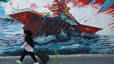 An Iranian woman walks next to a mural on a street in Tehran, Iran, May 11, 2026. Majid Asgaripour/WANA (West Asia News Agency) via REUTERS ATTENTION EDITORS - THIS PICTURE WAS PROVIDED BY A THIRD PARTY