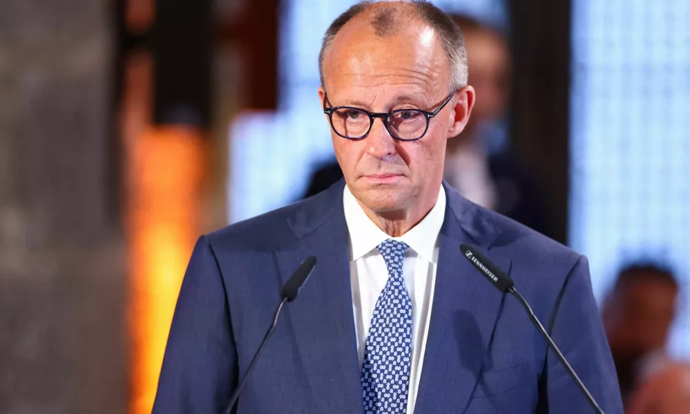 German Chancellor Friedrich Merz speaks during a ceremony to award European Central Bank (ECB) former President and Italian former Prime Minister Mario Draghi the International Charlemagne Prize (Karlspreis) 2026, in Aachen, Germany, May 14, 2026. REUTERS/Thilo Schmuelgen