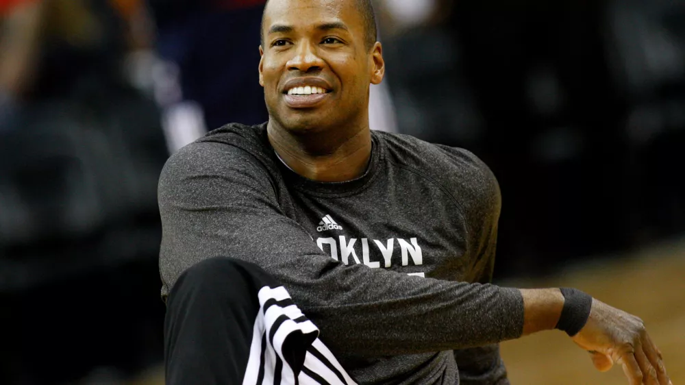FILE - Brooklyn Nets center Jason Collins warms up before an NBA basketball game in New Orleans, March 24, 2014. (AP Photo/Jonathan Bachman, File)