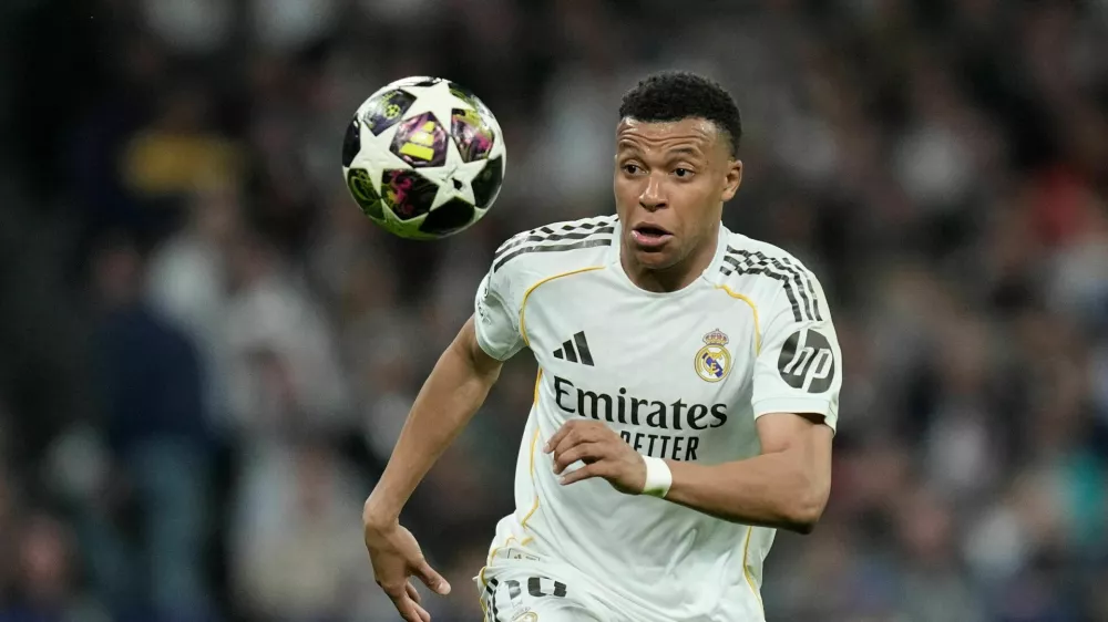 Real Madrid's Kylian Mbappe watches the ball during the Champions League quarterfinal first leg soccer match between Real Madrid and Bayern Munich in Madrid, Spain, Tuesday, April 7, 2026. (AP Photo/Bernat Armangue)