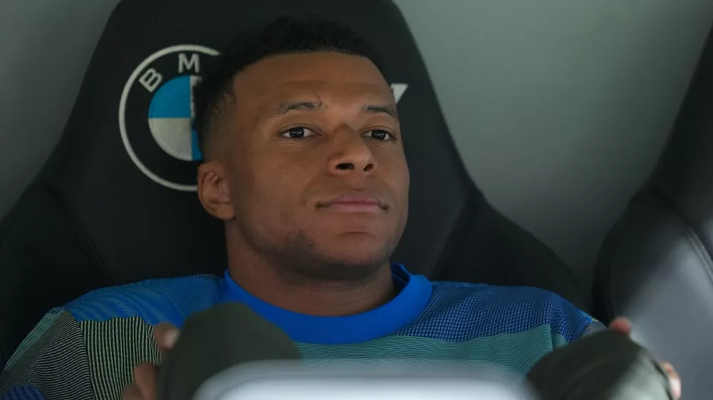 Real Madrid's Kylian Mbappe looks out from the bench prior to the Spanish La Liga soccer match between Real Madrid and Real Oviedo in Madrid, Spain, Thursday, May 14, 2026. (AP Photo/Manu Fernandez)