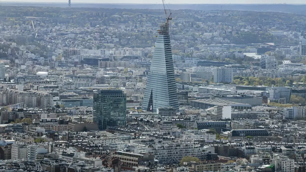 This photograph taken from the observation gallery on the top of the Tour Montparnasse (Montparnasse Tower) shows the Tour Triangle, designed by Swiss firm Herzog & de Meuron, under construction in Paris on March 30, 2026,Image: 1087703324, License: Rights-managed, Restrictions:, Model Release: no 
