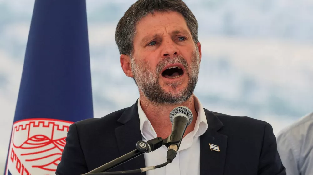 FILE PHOTO: Israeli Finance Minister Bezalel Smotrich speaks at a press conference regarding settlements expansion for the long-frozen E1 settlement, that would split East Jerusalem from the occupied West Bank, near the Israeli settlement of Maale Adumim in the Israeli-occupied West Bank, August 14, 2025. REUTERS/Ronen Zvulun/File Photo