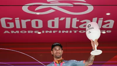 Cycling - Giro d'Italia - Stage 10 ITT - Viareggio to Massa - Italy - May 19, 2026 Netcompany INEOS's Filippo Ganna celebrates on the podium after winning Stage 10 ITT REUTERS/Jennifer Lorenzini