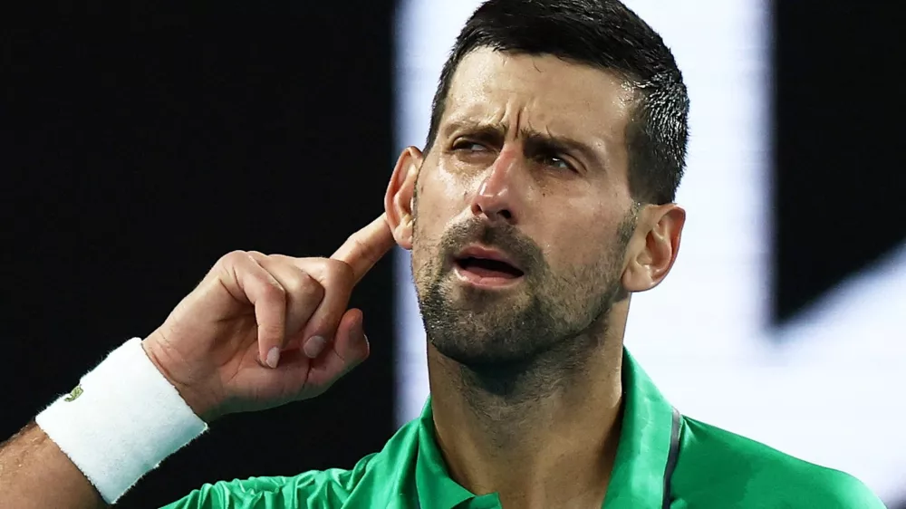 Tennis - Australian Open - Melbourne Park, Melbourne, Australia - January 24, 2026 Serbia's Novak Djokovic celebrates and gestures to crowd after winning his third round match against Netherlands' Botic van de Zandschulp REUTERS/Tingshu Wang  TPX IMAGES OF THE DAY