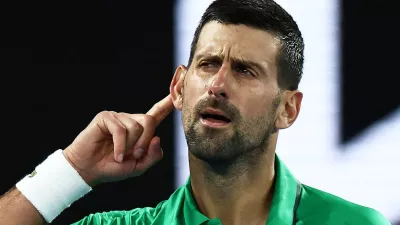 Tennis - Australian Open - Melbourne Park, Melbourne, Australia - January 24, 2026 Serbia's Novak Djokovic celebrates and gestures to crowd after winning his third round match against Netherlands' Botic van de Zandschulp REUTERS/Tingshu Wang  TPX IMAGES OF THE DAY